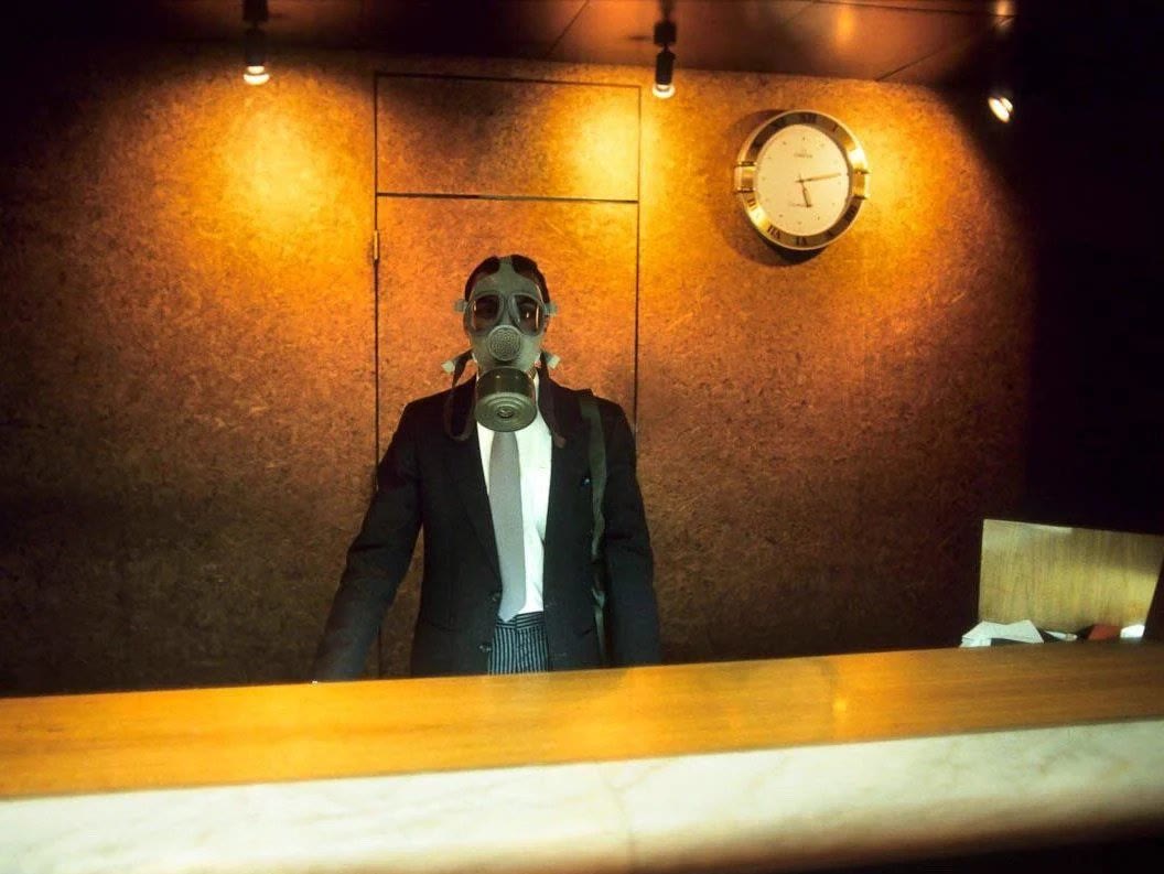 A hotel receptionist during a Scud missile alert at the Le Méridien, during the 1st gulf war Dhahran, Saudi Arabia 1991