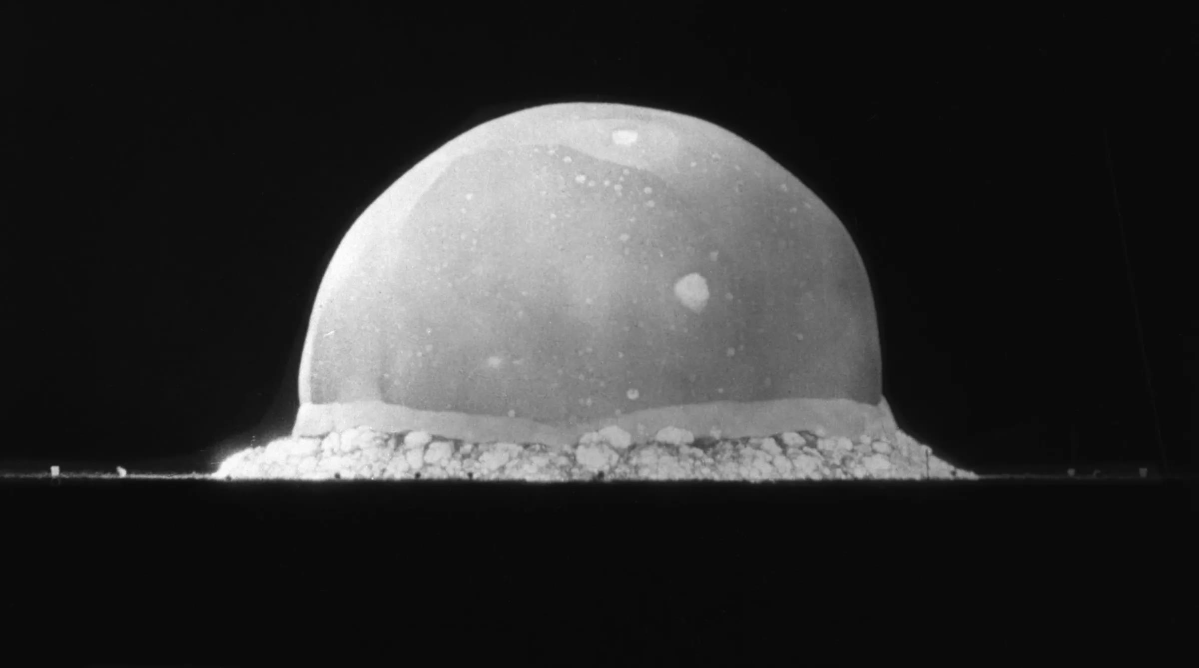 At 0.016 seconds after the atomic detonation, the fireball was already hundreds of meters wide. The tiny squares to the left and right in this image are billboards 200 meters from the center of the explosion - Los Alamos National Laboratory