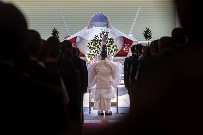 Shinto priest blessing a F-35