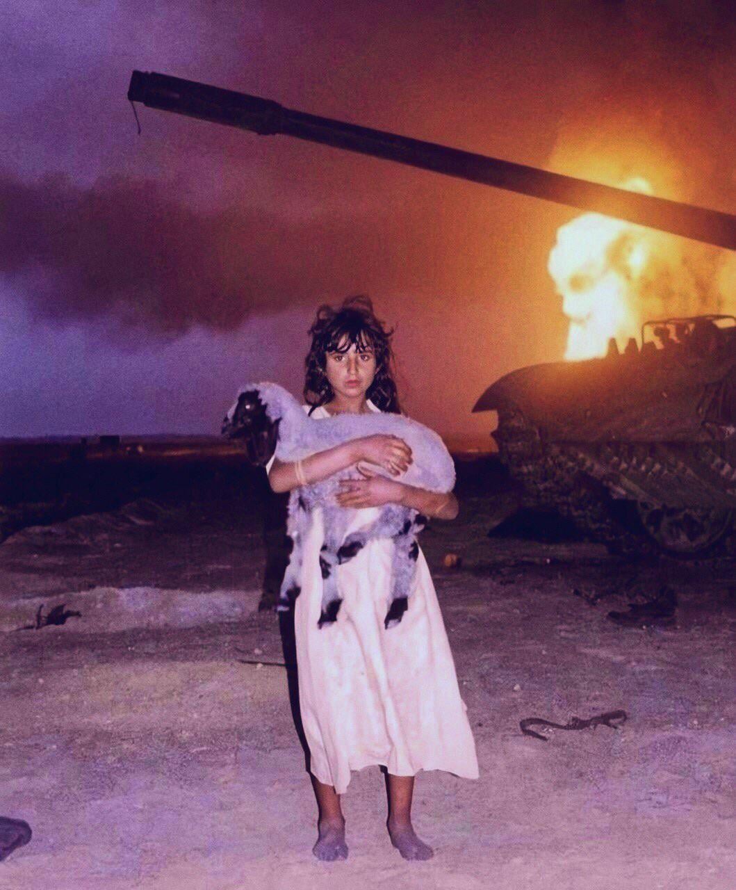 Young Kuwaiti girl holding her lamb during the Gulf War 1991